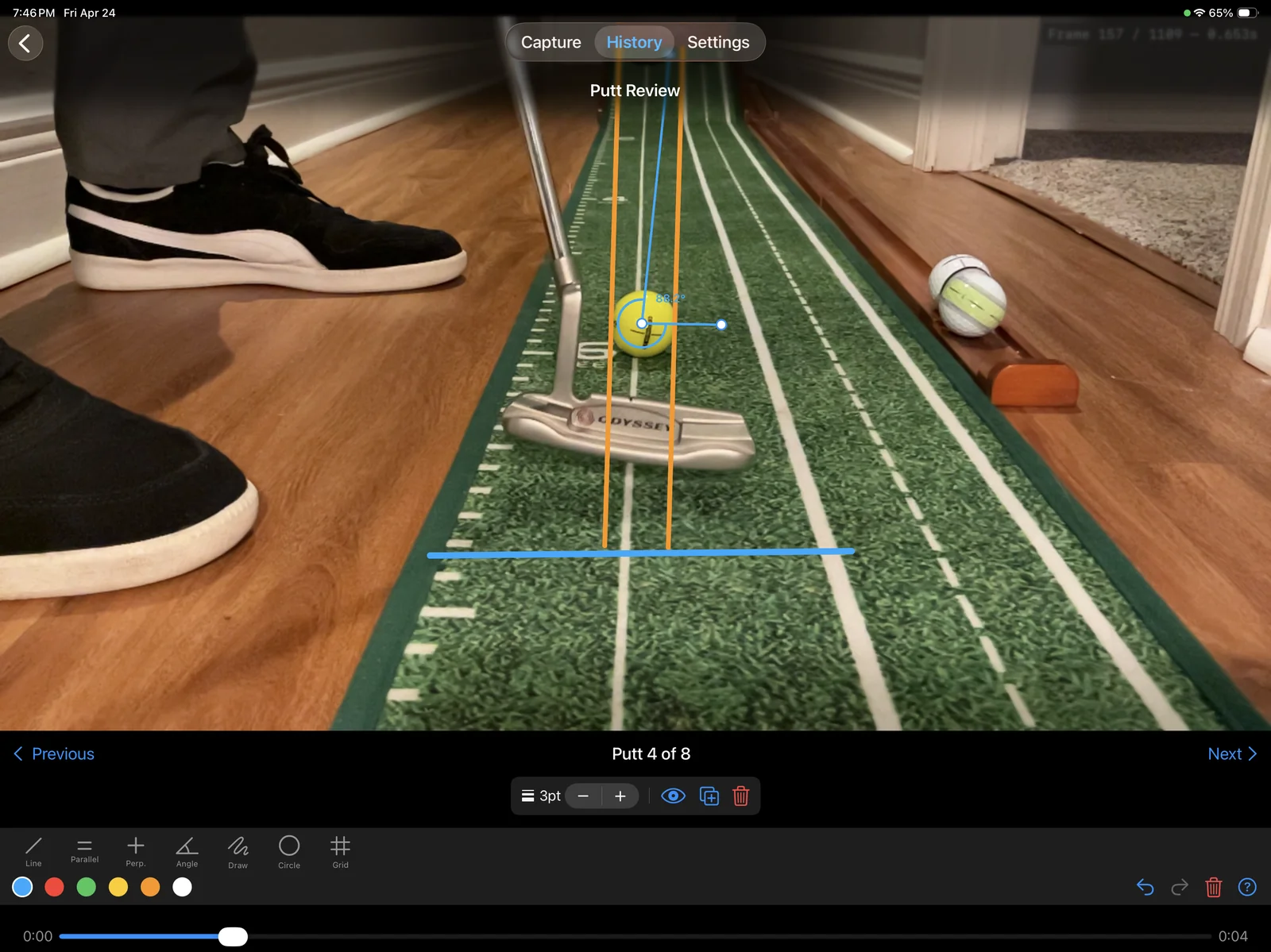 PuttLens reviewing a putt with annotation lines, parallel guides, and an angle measurement overlaid on the stroke